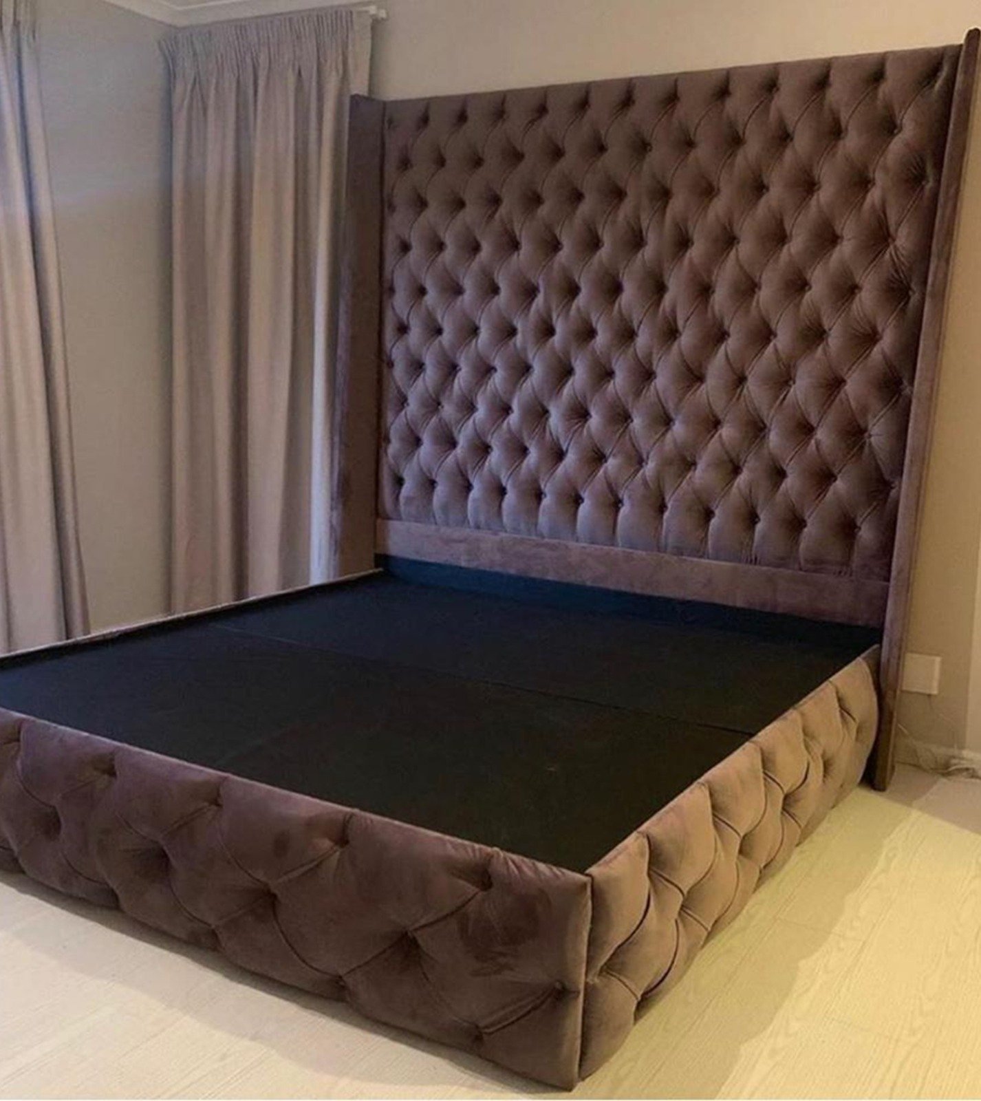 Upholstered bed and headboard in a bedroom