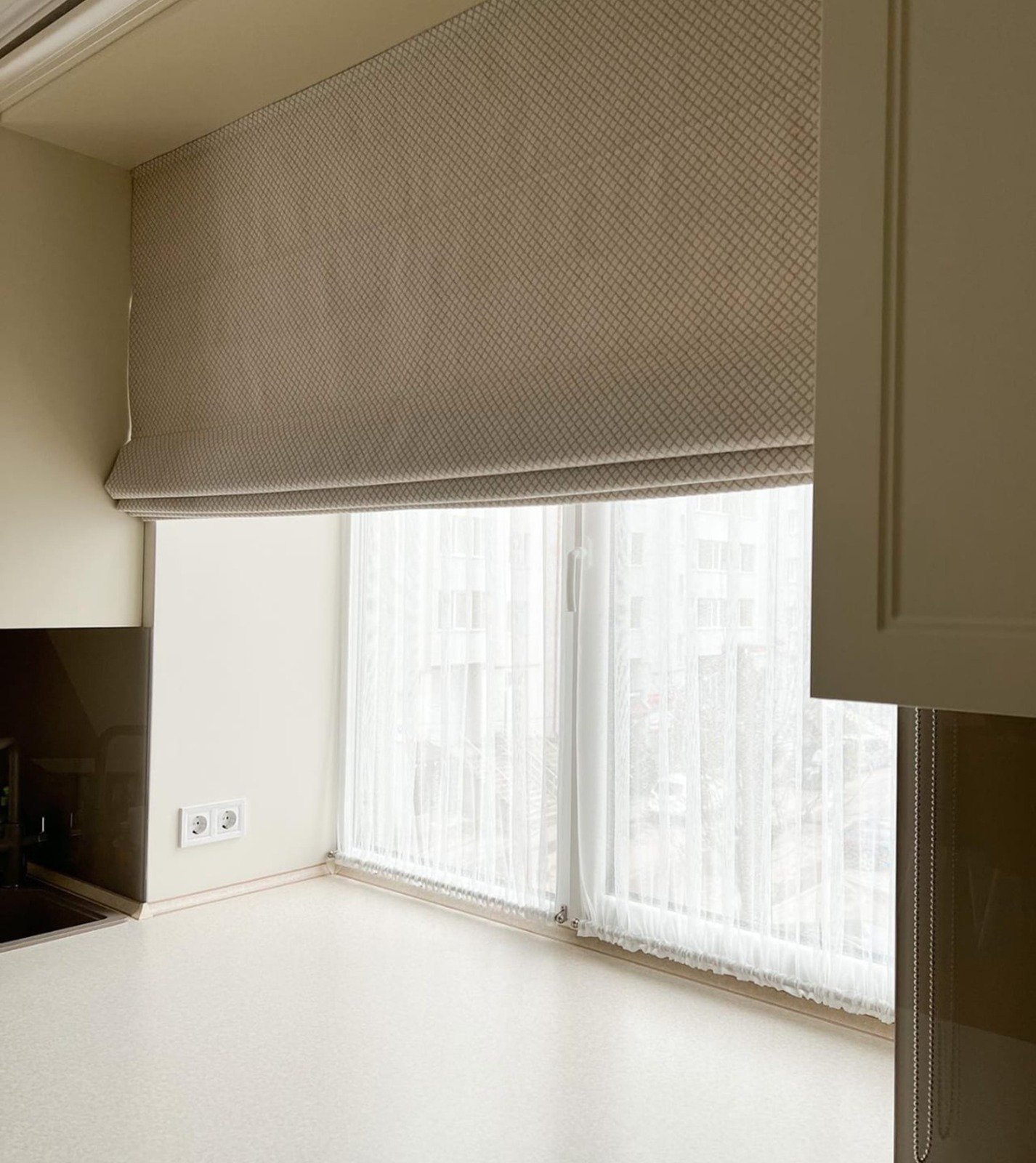 Roman blinds fitted to a living room window