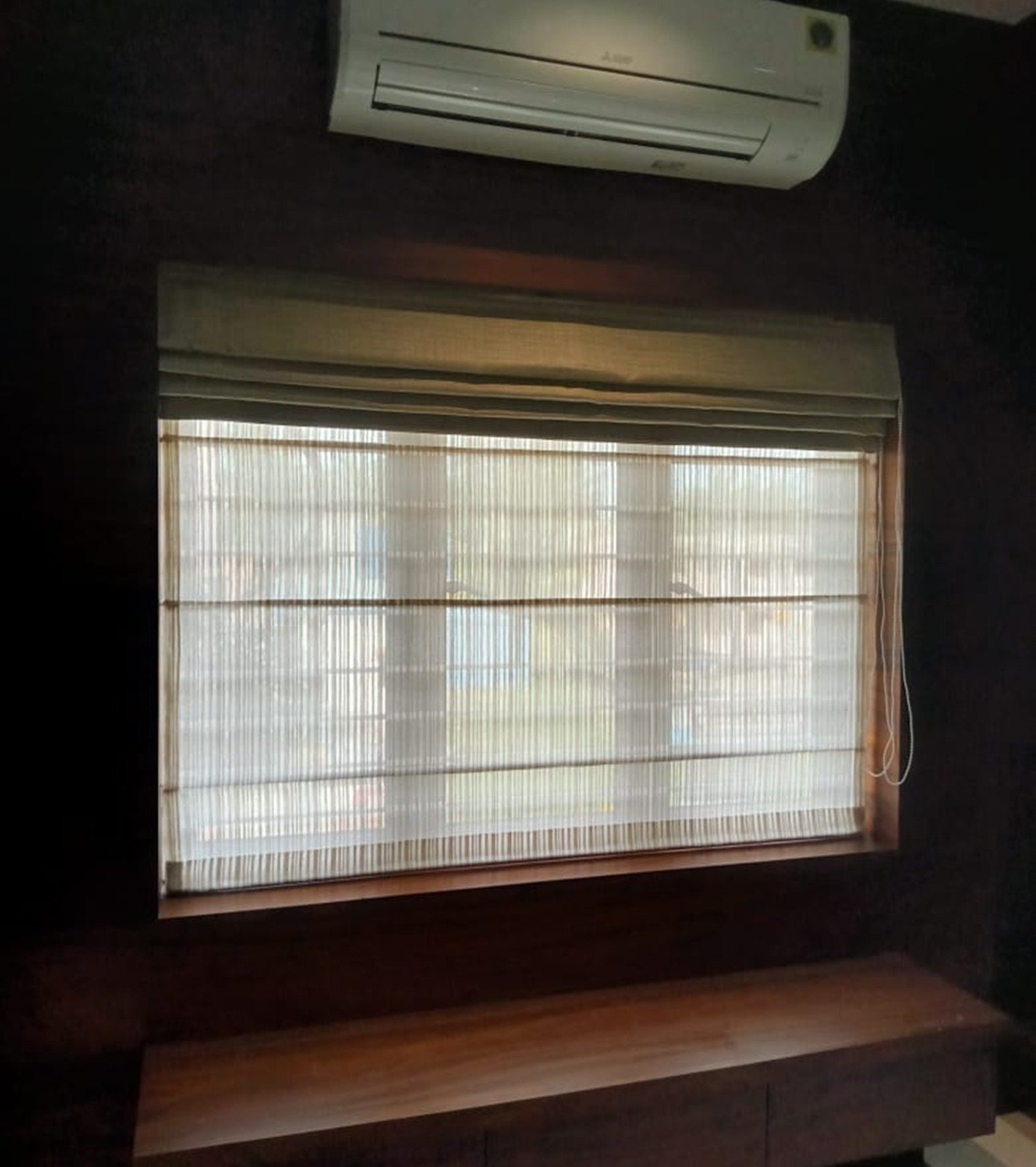 Roman blinds folded neatly above a window