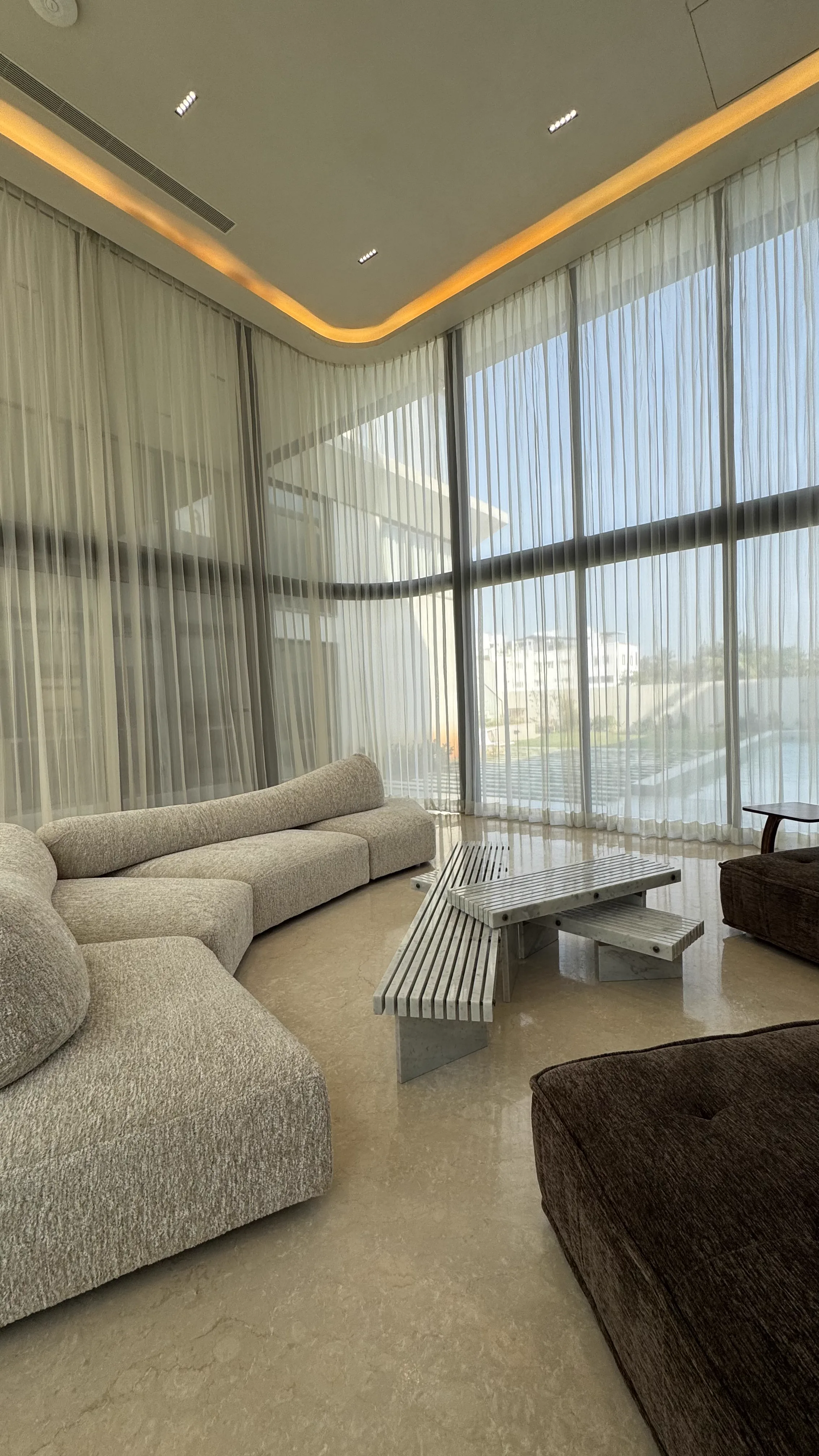 Sheer blinds on a floor-to-ceiling corner window