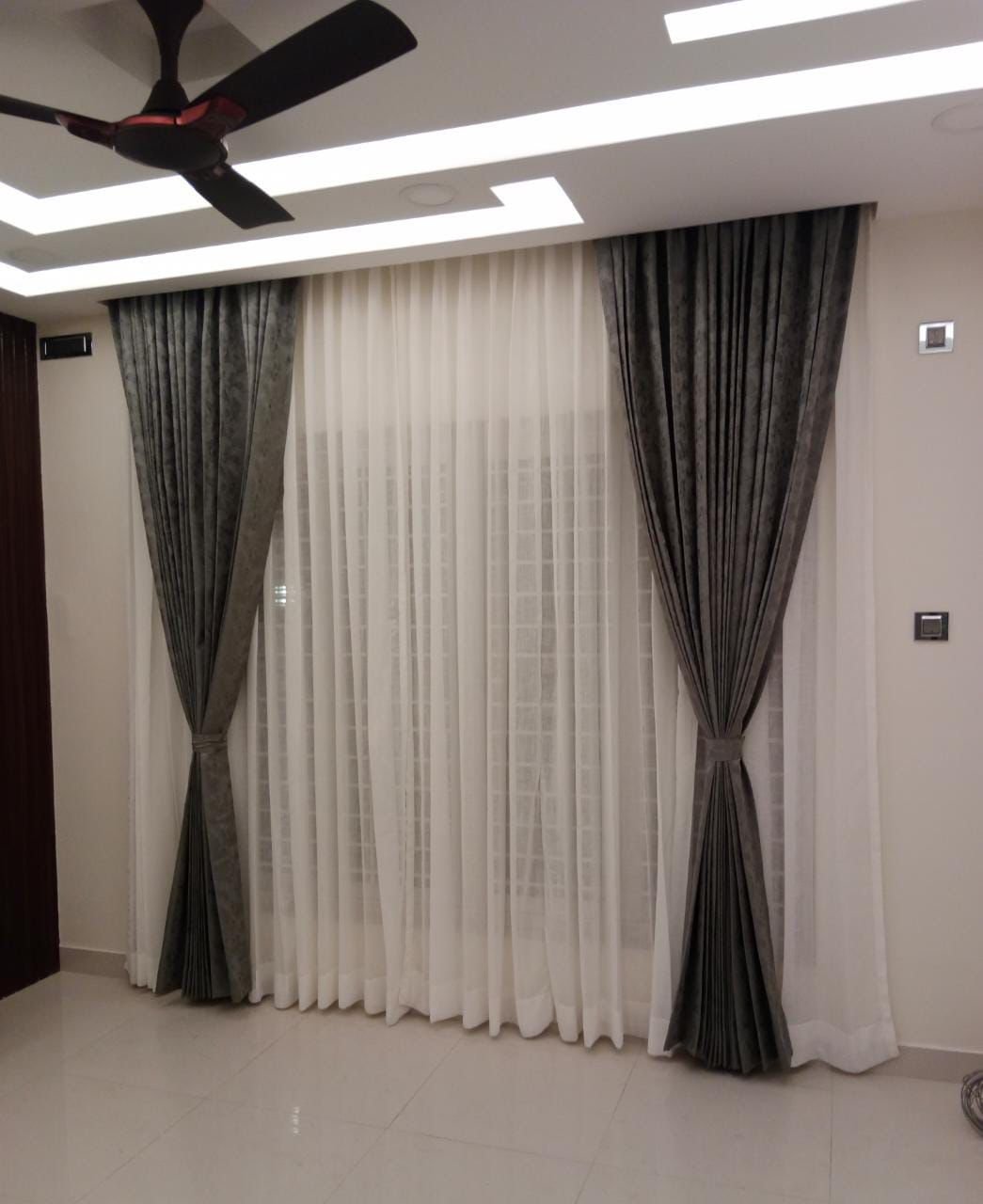Grey velvet L-shaped sofa upholstery